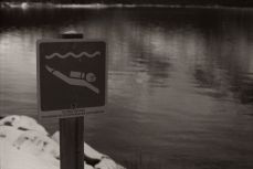 A sign indicates a dive site to discover the submerged Minnewanka Landing
